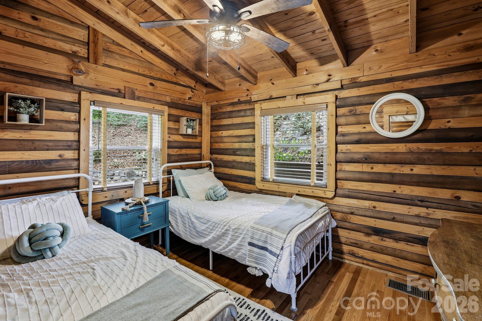 118 Rock Pt Road Lake Lure, NC 28746 - Photo 20 of 31 a bedroom with bed and balcony