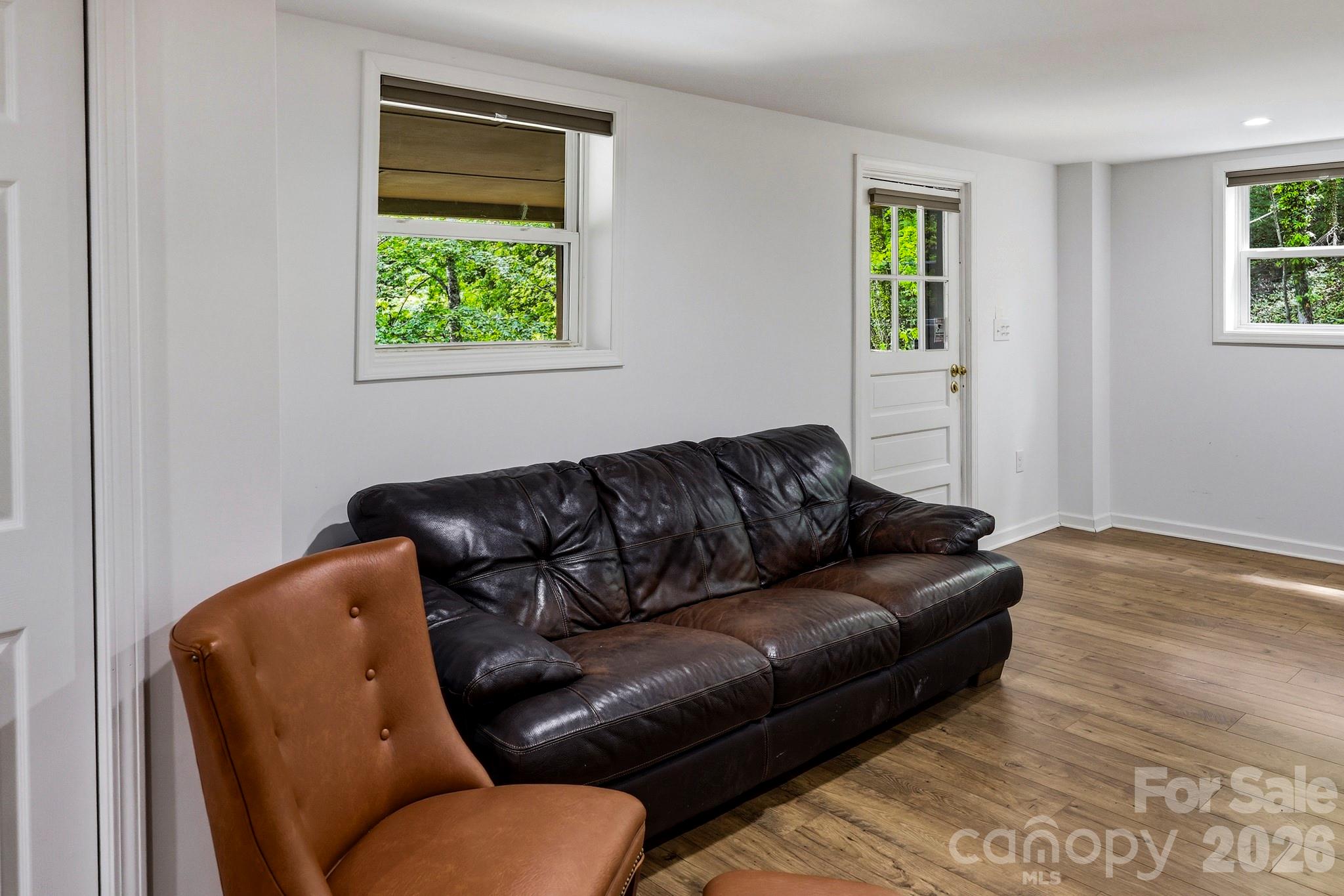 118 Rock Pt Road Lake Lure, NC 28746 - Photo 22 of 31 a living room with a couch and a window