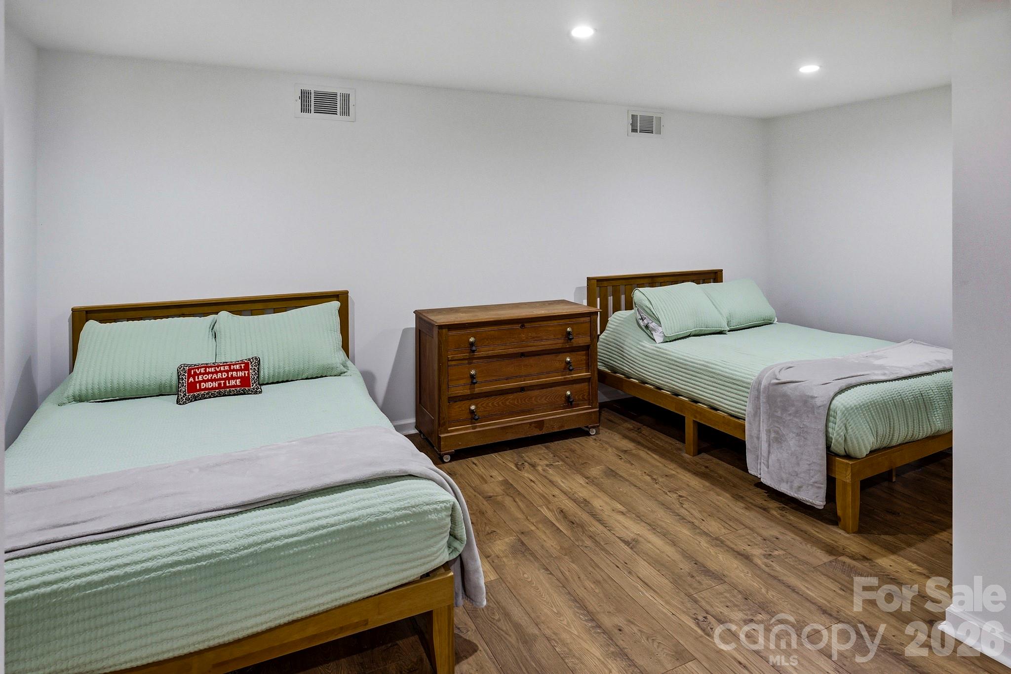 118 Rock Pt Road Lake Lure, NC 28746 - Photo 23 of 31 a bedroom with a bed and a night stand