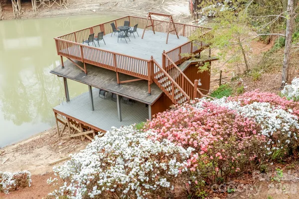 a balcony with table and chairs