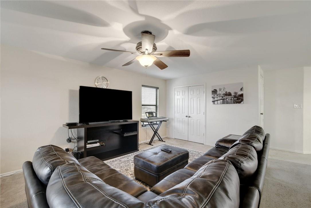 356 Matthews Kyle, TX 78640 - Photo 8 of 30 A well-lit family room offers comfortable living and convenient storage options.