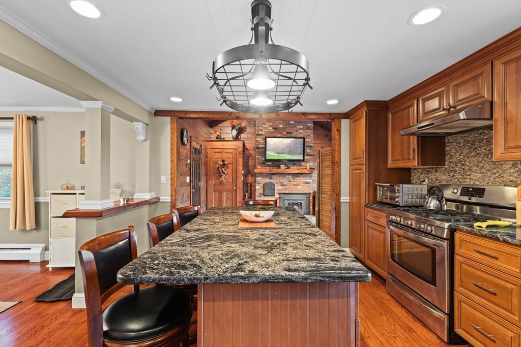 5 Staffon Road Fairhaven, MA 02719 - Photo 5 of 41 a kitchen with stainless steel appliances granite countertop a stove refrigerator and cabinets