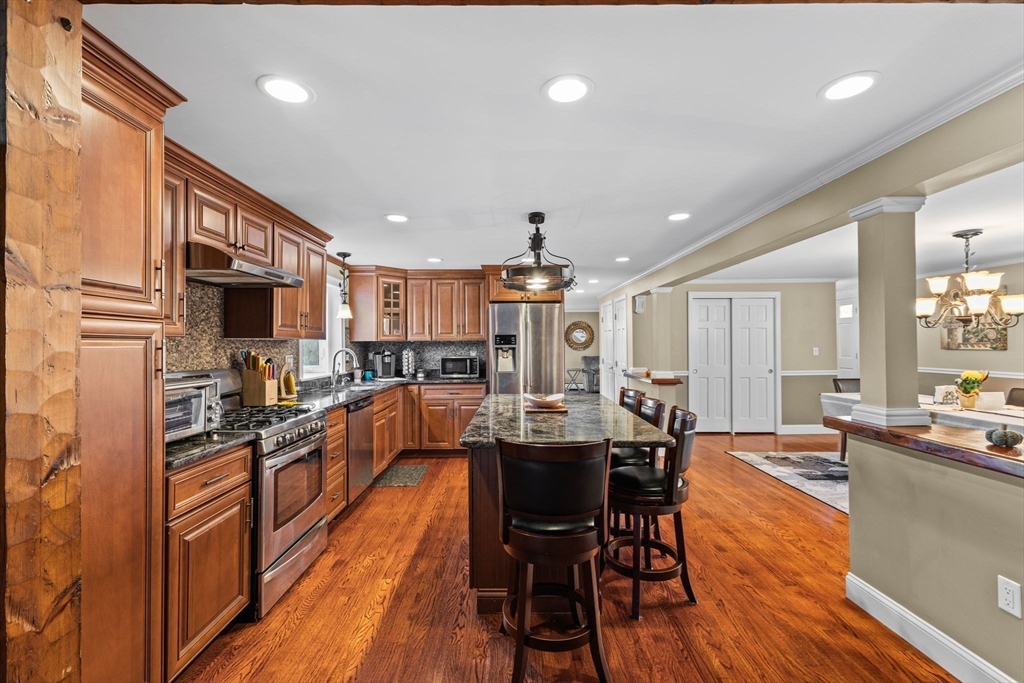 5 Staffon Road Fairhaven, MA 02719 - Photo 7 of 41 a dining hall with stainless steel appliances granite countertop a couch dining table and chairs