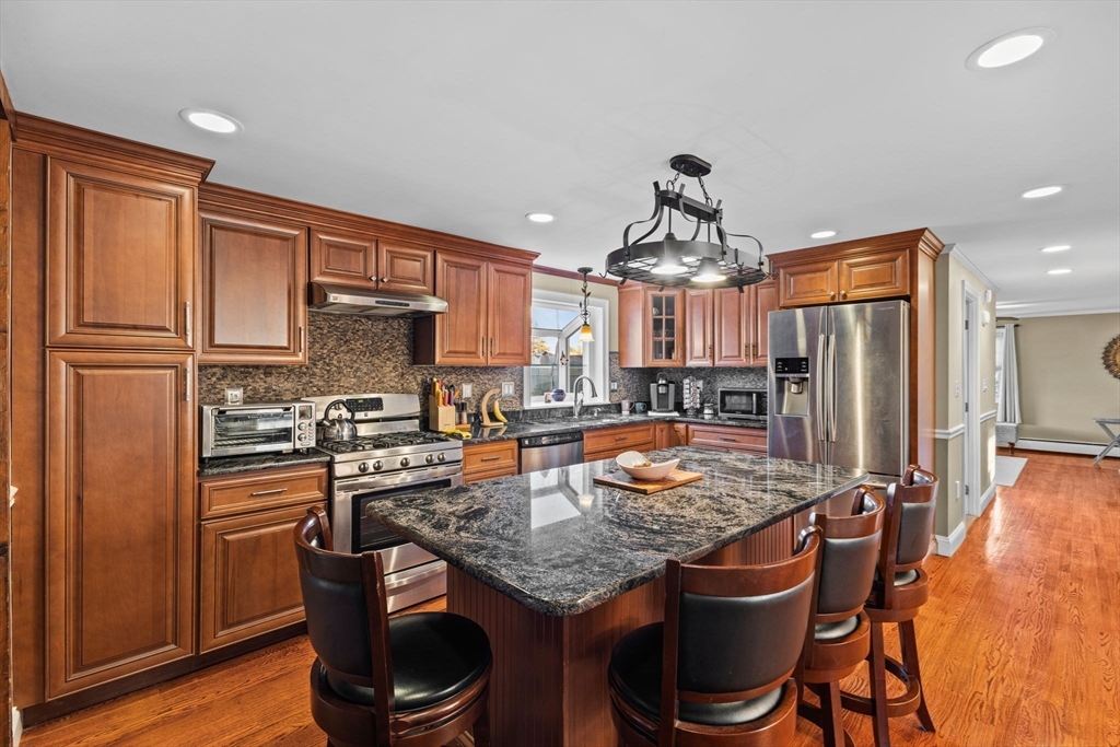 5 Staffon Road Fairhaven, MA 02719 - Photo 8 of 41 a kitchen with stainless steel appliances granite countertop a stove refrigerator and a refrigerator