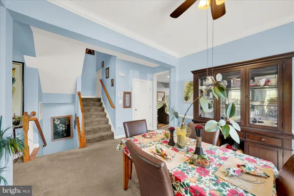 a living room with furniture and next to a window