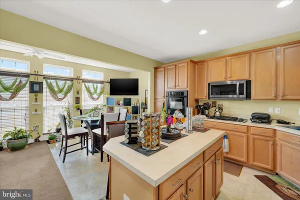 a kitchen with a stove a sink and a refrigerator