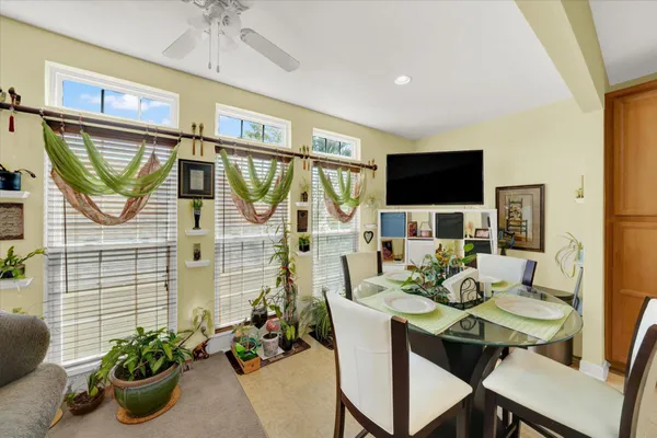 a work room with furniture and a potted plant