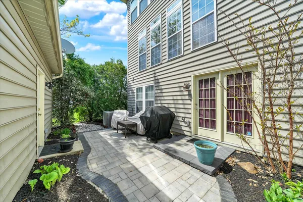 a view of a patio with two chairs and a table