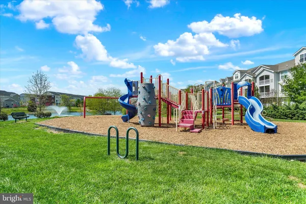 a view of a park with swings and slides