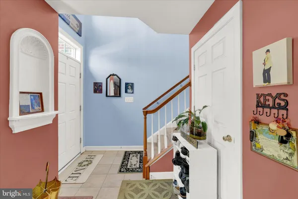 a view of an entryway with wooden floor