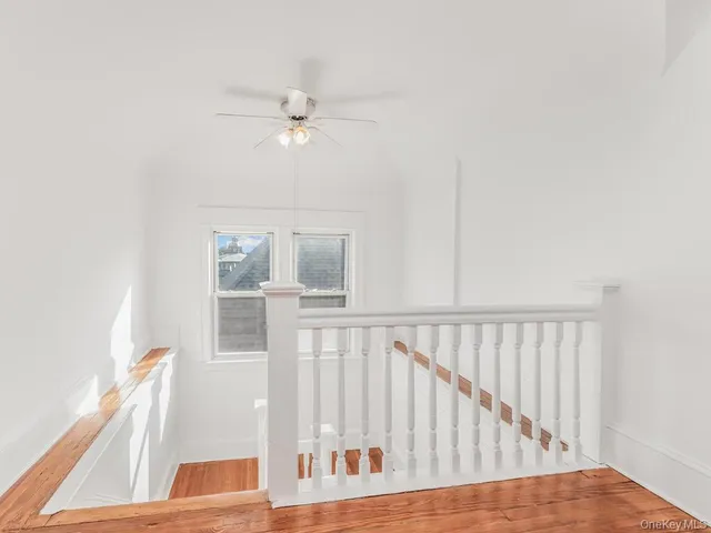 a view of staircase with white walls
