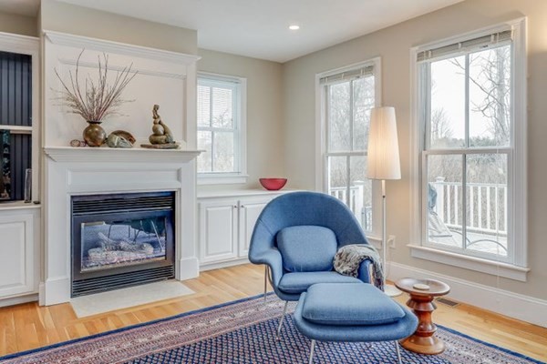 7 Cod Lane, Unit 7 Harwich, MA 02646 - Photo 12 of 41 a living room with furniture a rug and a fireplace