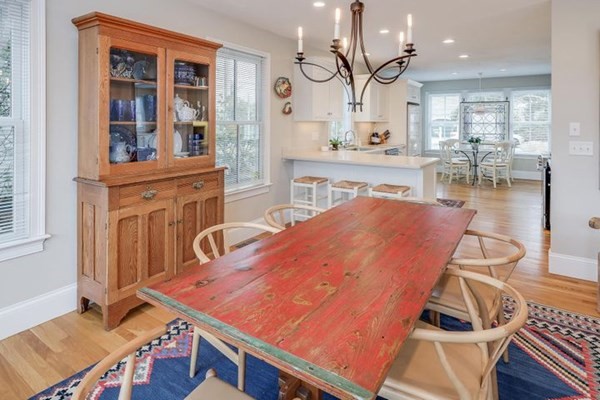 7 Cod Lane, Unit 7 Harwich, MA 02646 - Photo 15 of 41 a dining room with wooden floor and large windows