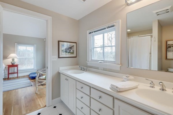 7 Cod Lane, Unit 7 Harwich, MA 02646 - Photo 31 of 41 a bathroom with a sink and a mirror