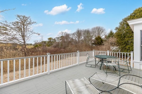 7 Cod Lane, Unit 7 Harwich, MA 02646 - Photo 6 of 41 a view of a chair and table in the balcony