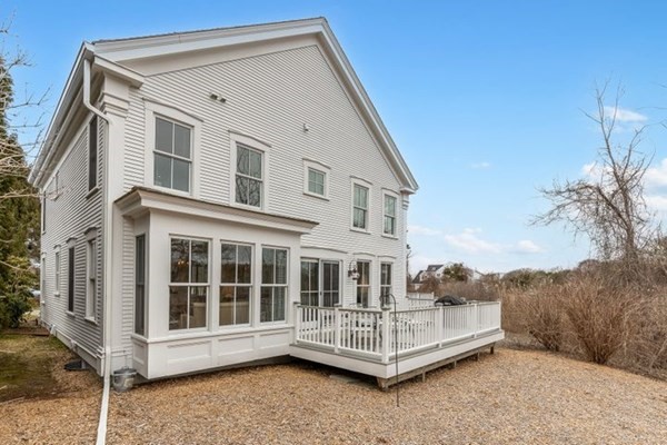 7 Cod Lane, Unit 7 Harwich, MA 02646 - Photo 8 of 41 a front view of a house with a yard