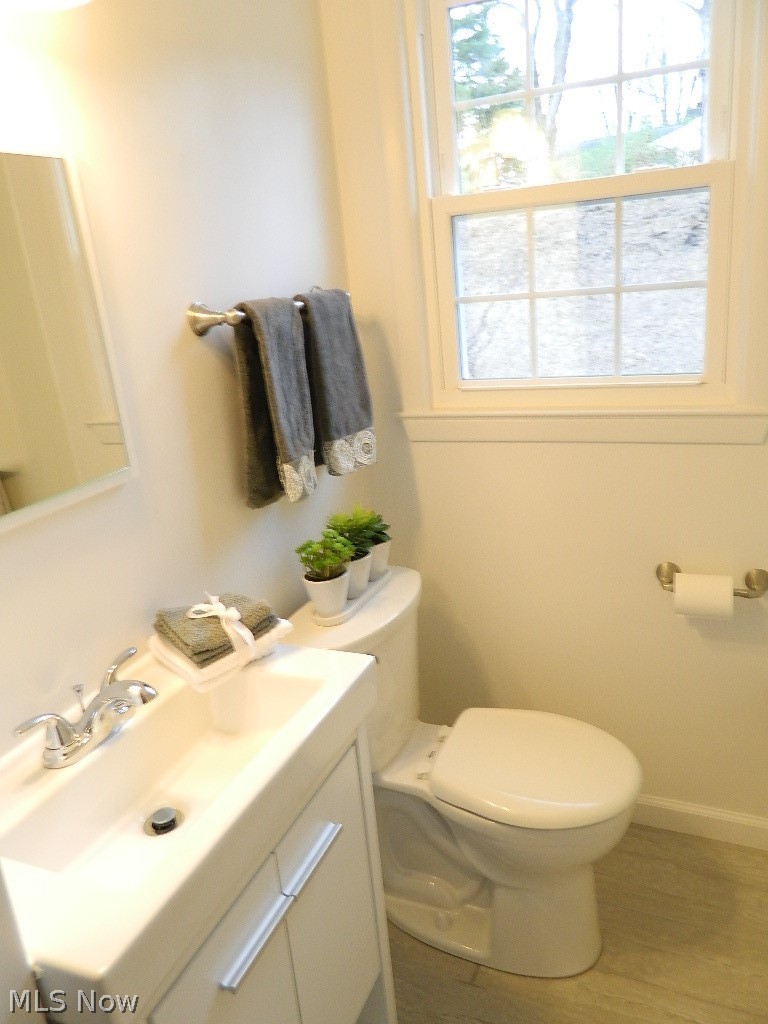 8675 Wilson Mills Road Chesterland, OH 44026 - Photo 12 of 23 One of Two Bathrooms .... This Bathroom has a Bathtub and Shower, New Ceramic Flooring, Vanity, Mirror and a Linen Closet!