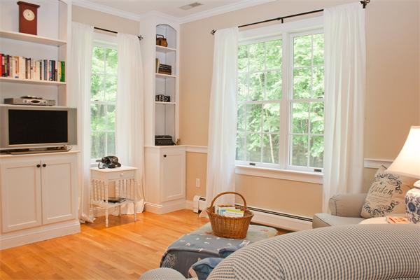 110 Kimball Road Carlisle, MA 01741 - Photo 12 of 25 a bedroom with furniture and a flat screen tv