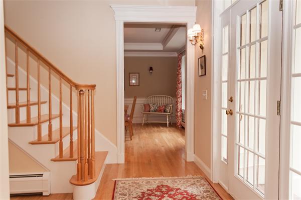 110 Kimball Road Carlisle, MA 01741 - Photo 13 of 25 a view of front door with hallway and wooden floor