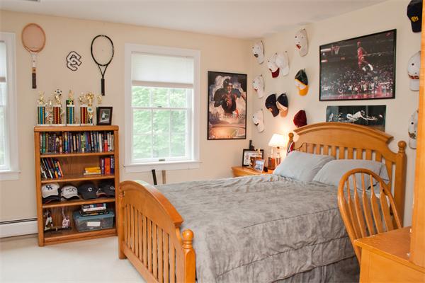 110 Kimball Road Carlisle, MA 01741 - Photo 19 of 25 a bedroom with furniture and a window