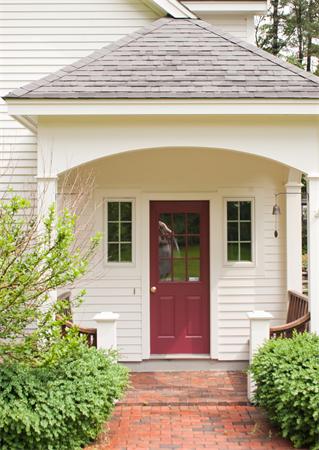 110 Kimball Road Carlisle, MA 01741 - Photo 2 of 25 a front view of a house with a garage