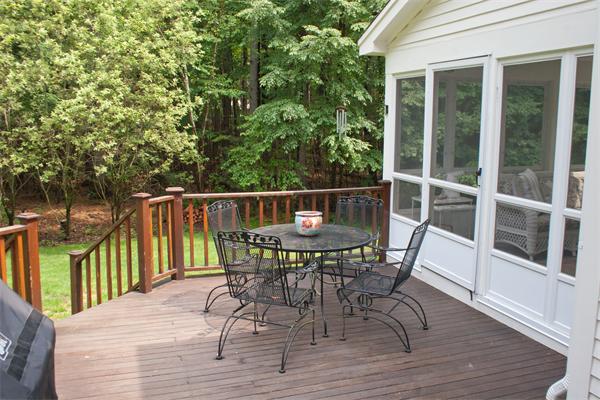 110 Kimball Road Carlisle, MA 01741 - Photo 24 of 25 a view of a chairs and table on the deck