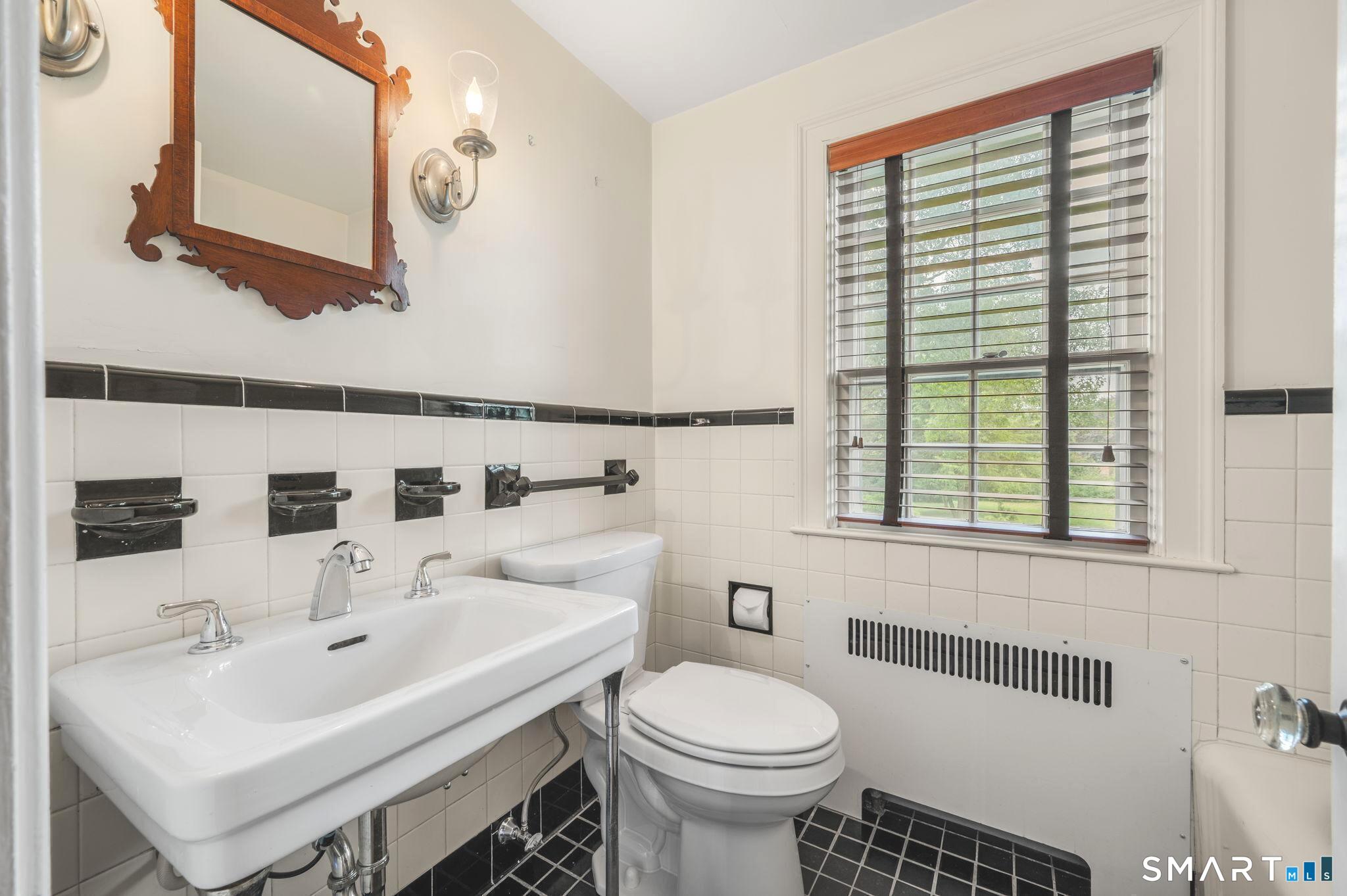 33 Coit Lane Norwich, CT 06360 - Photo 25 of 40 Upper-level hall bathroom with soaking tub and classic tile