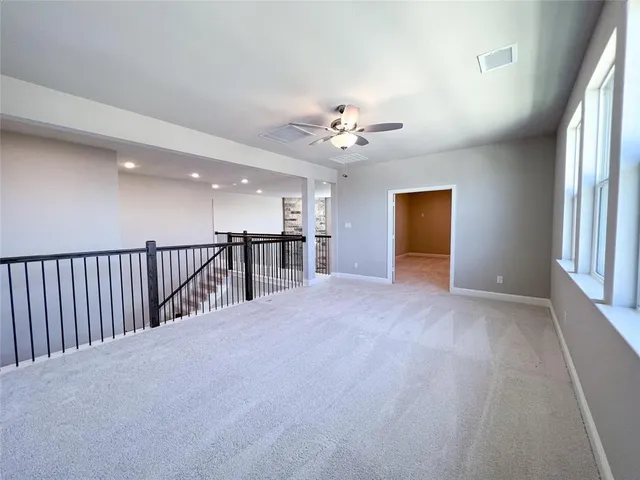 a kitchen with kitchen island granite countertop a sink a counter space appliances and cabinets