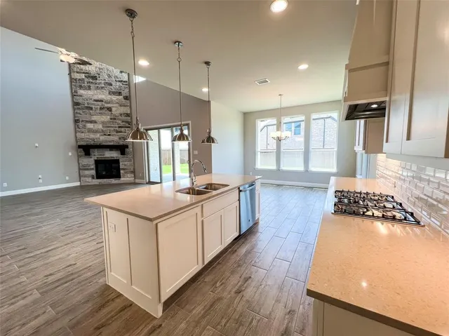 a view of an house with backyard space and balcony