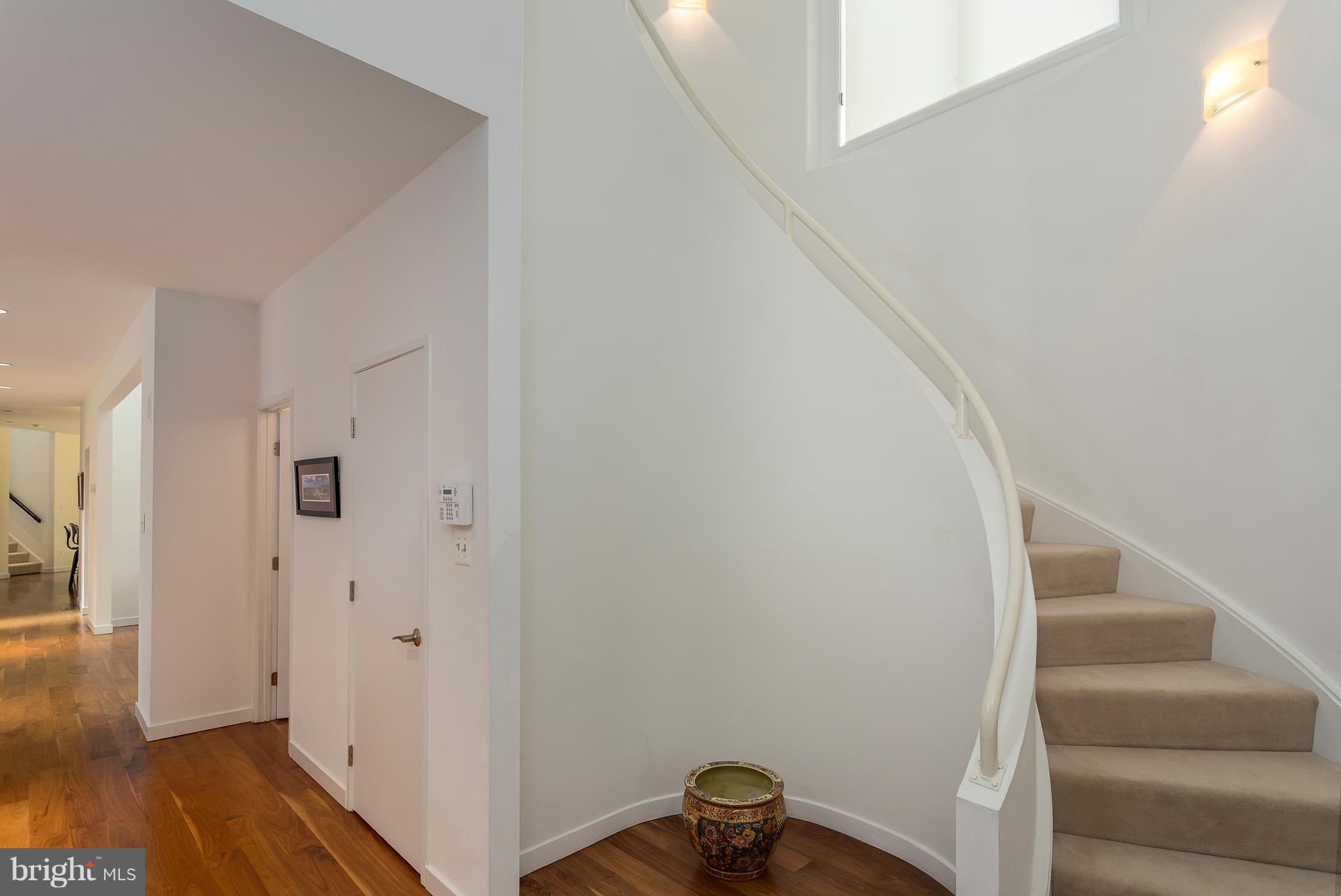 2038 Beacon Place Reston, VA 20191 - Photo 2 of 28 Dramatic curved staircase at entry