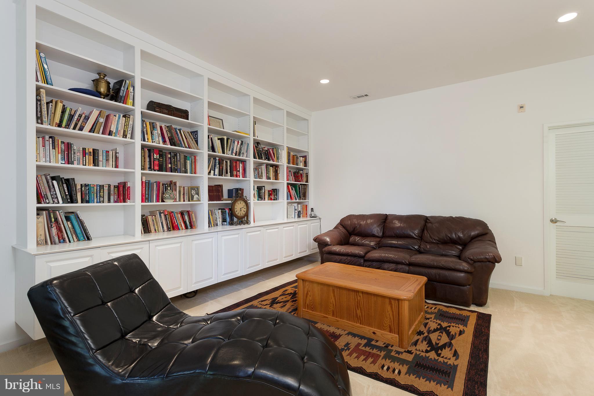2038 Beacon Place Reston, VA 20191 - Photo 22 of 28 Rec room w/wall-to-wall shelving