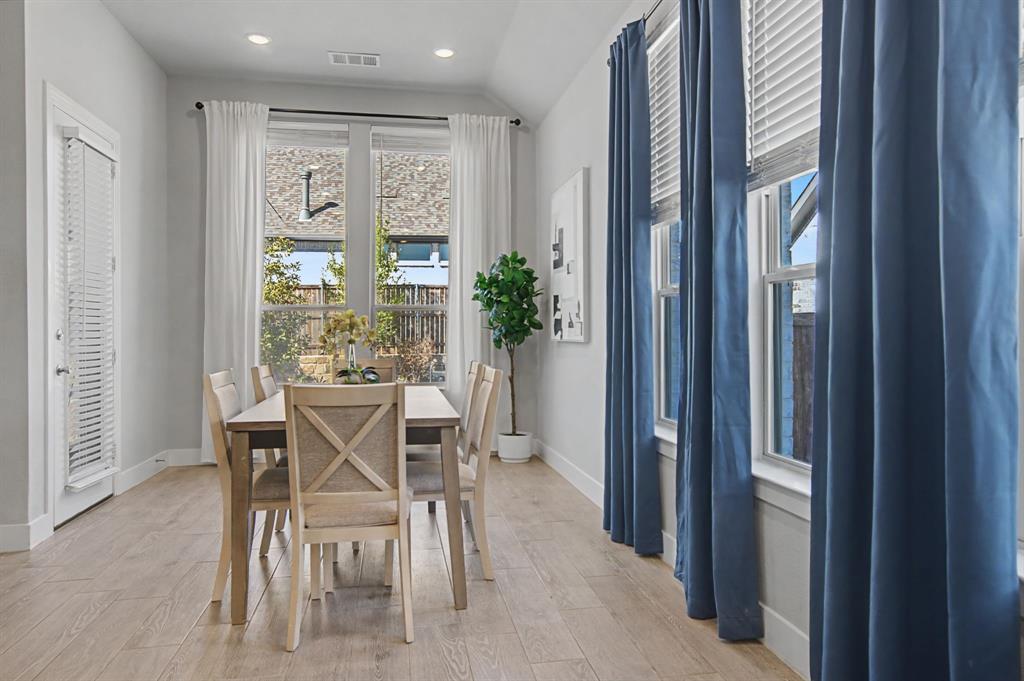 1101 Claiborne Drive Aubrey, TX 76227 - Photo 14 of 40 a dining room with furniture and window