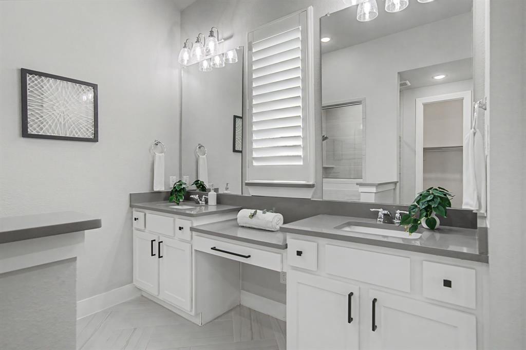 1101 Claiborne Drive Aubrey, TX 76227 - Photo 19 of 40 a bathroom with a sink and a mirror