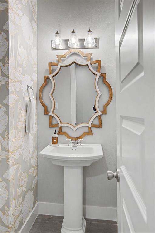 1101 Claiborne Drive Aubrey, TX 76227 - Photo 27 of 40 a bathroom with a sink and mirror