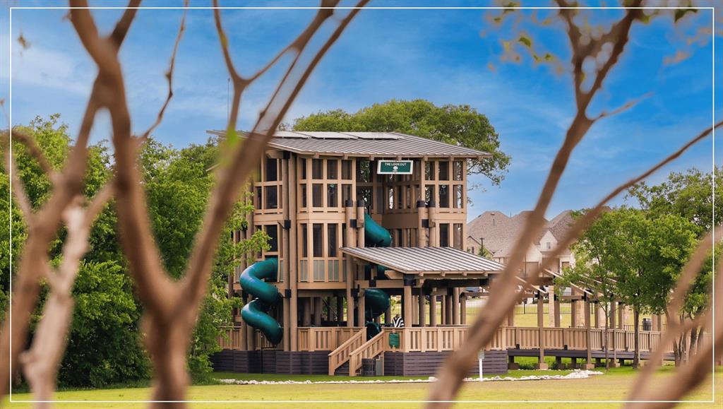 1101 Claiborne Drive Aubrey, TX 76227 - Photo 36 of 40 a view of a big yard in front of a house with a fountain