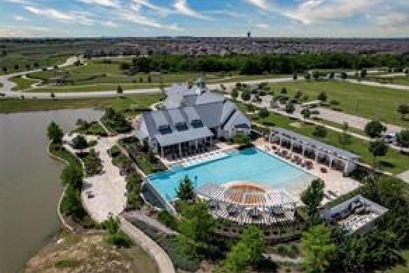 1101 Claiborne Drive Aubrey, TX 76227 - Photo 40 of 40 an aerial view of a house with a lake view