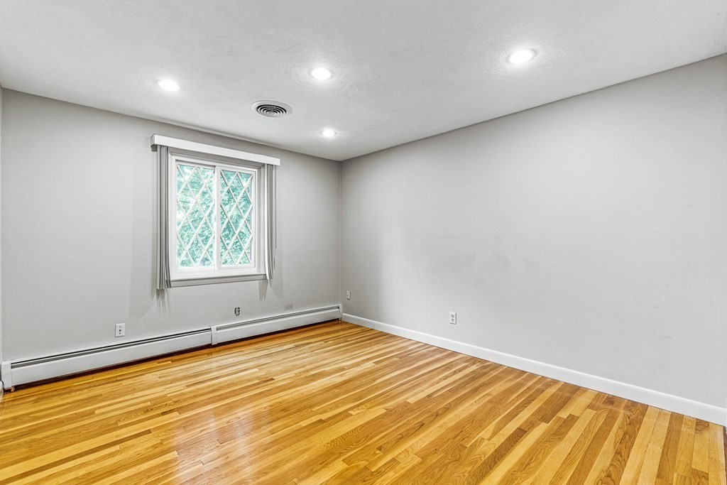 17 Gerald Road Marblehead, MA 01945 - Photo 19 of 36 an empty room with wooden floor and windows