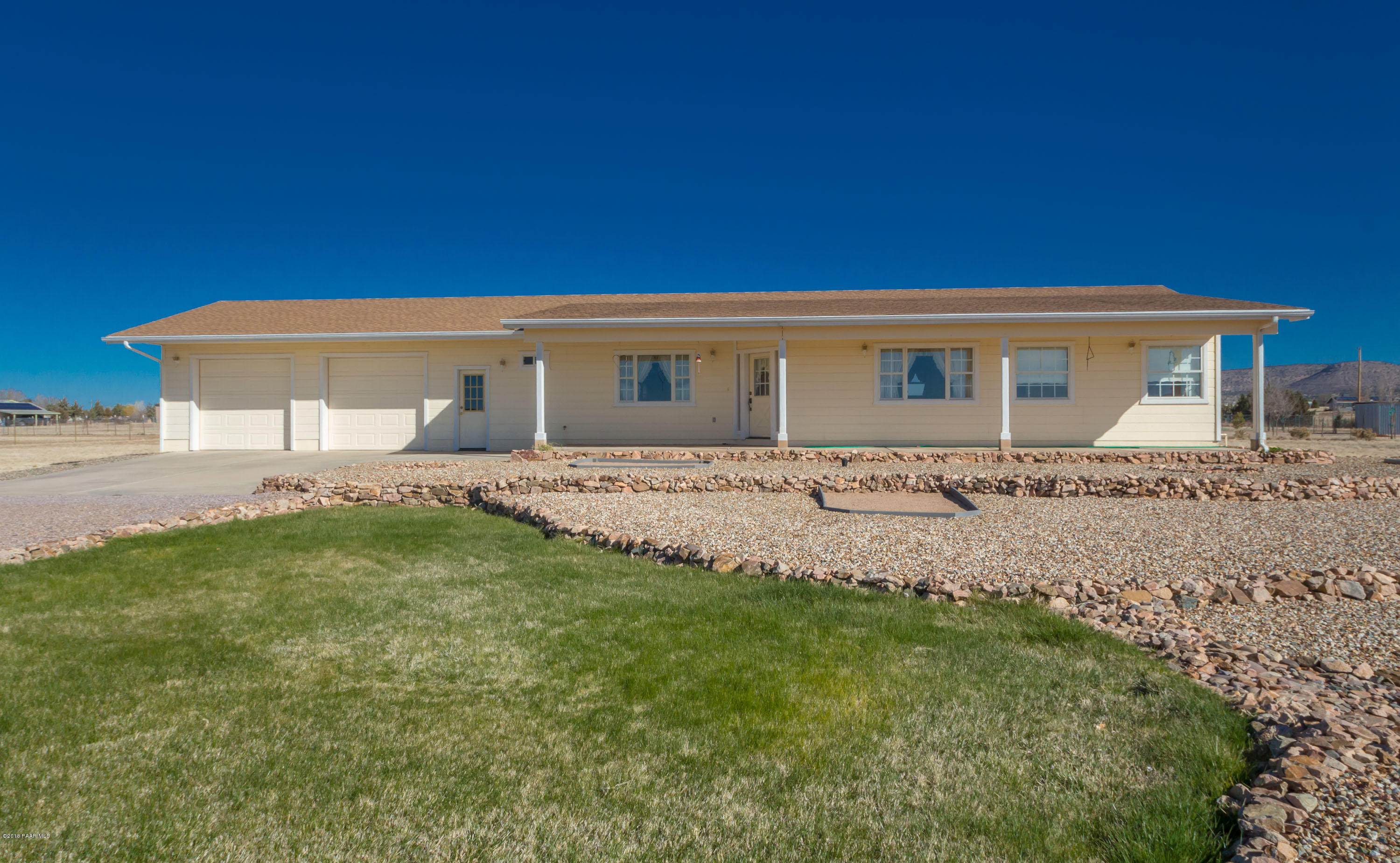 1050 Ranch House Road Paulden, AZ 86334 - Photo 1 of 19 a backyard of a house with table and chairs