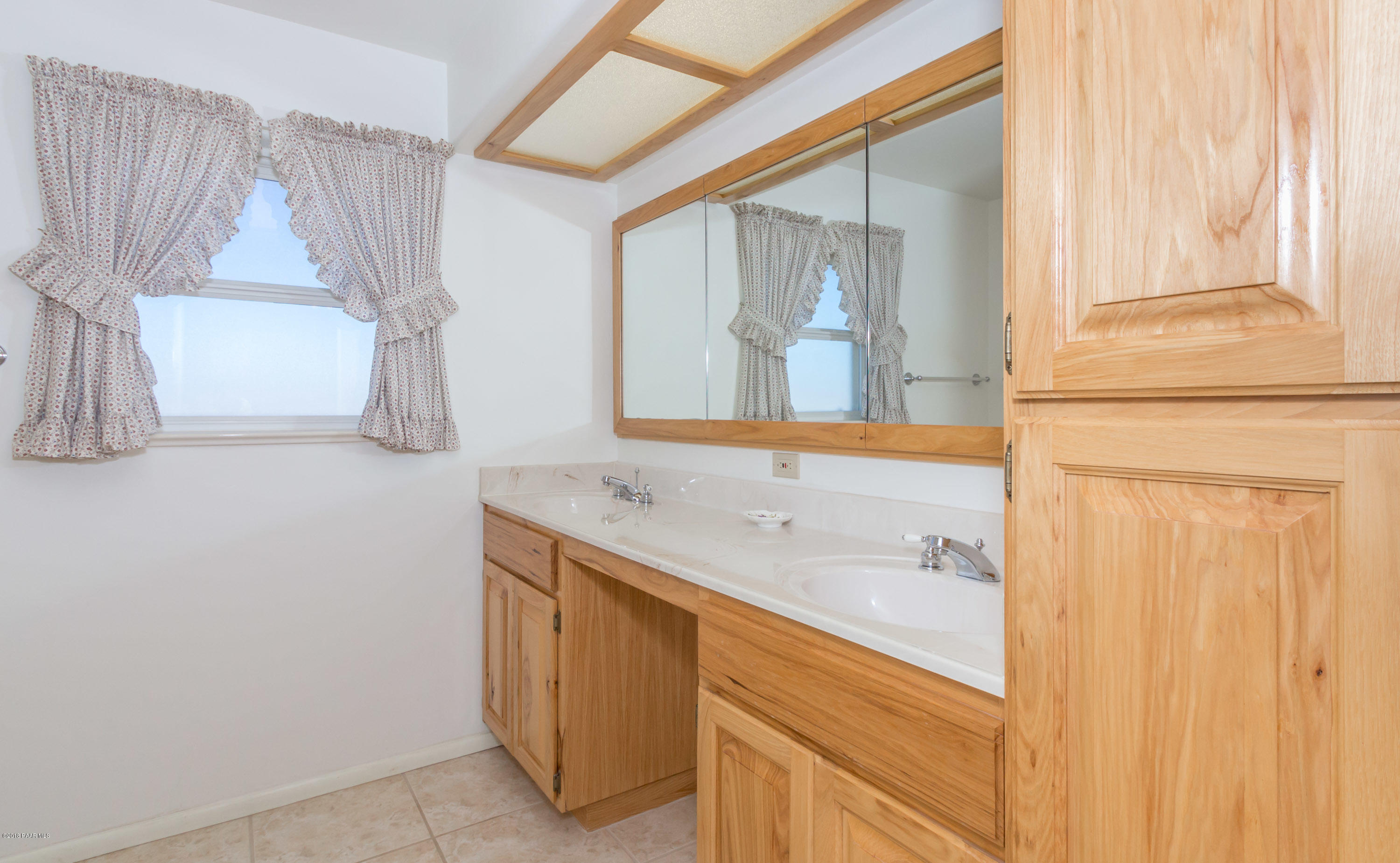 1050 Ranch House Road Paulden, AZ 86334 - Photo 12 of 19 a bathroom with a sink and a mirror