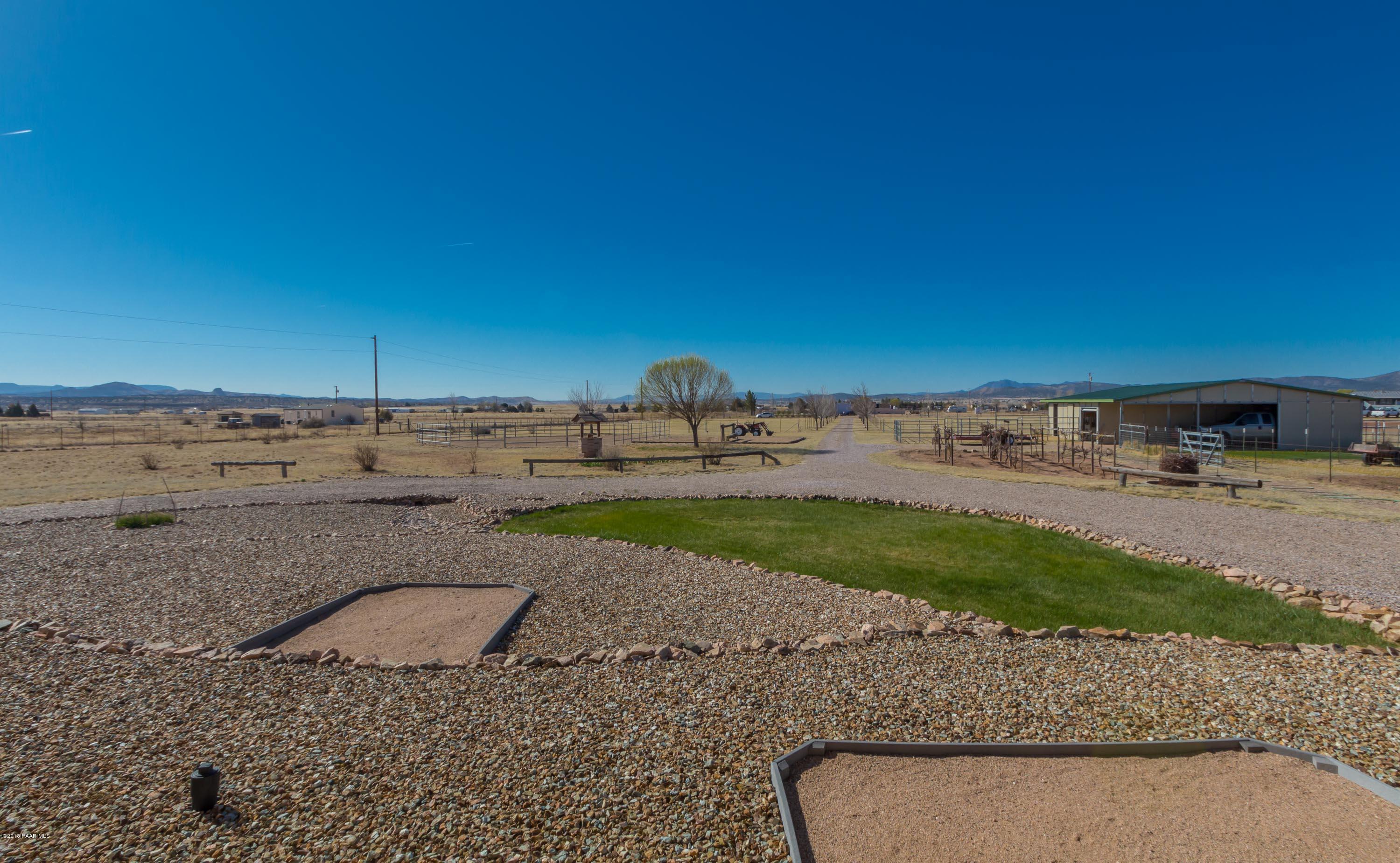 1050 Ranch House Road Paulden, AZ 86334 - Photo 15 of 19 a view of a road with a building in the background