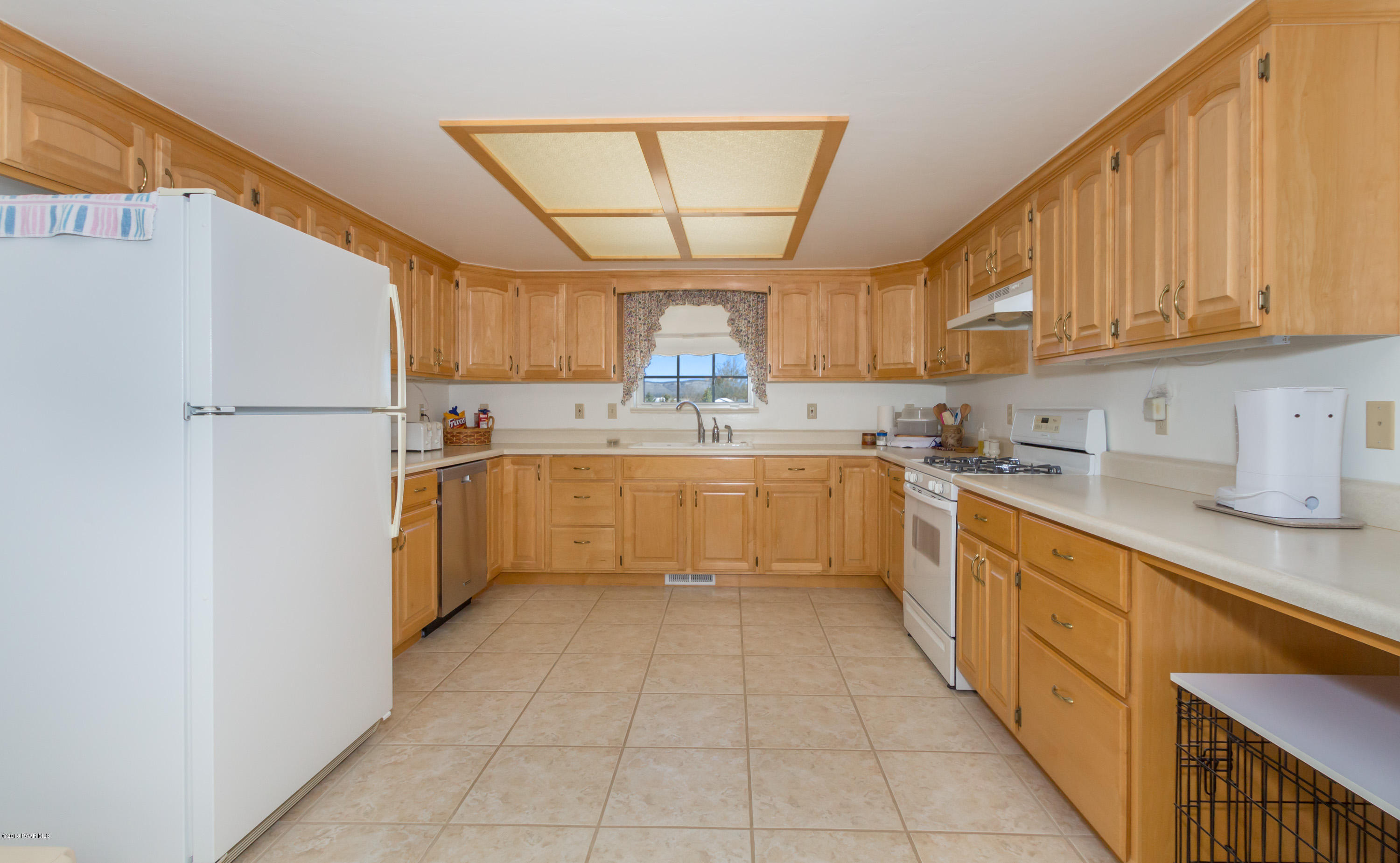 1050 Ranch House Road Paulden, AZ 86334 - Photo 3 of 19 a kitchen with stainless steel appliances granite countertop a sink a refrigerator and a cabinets