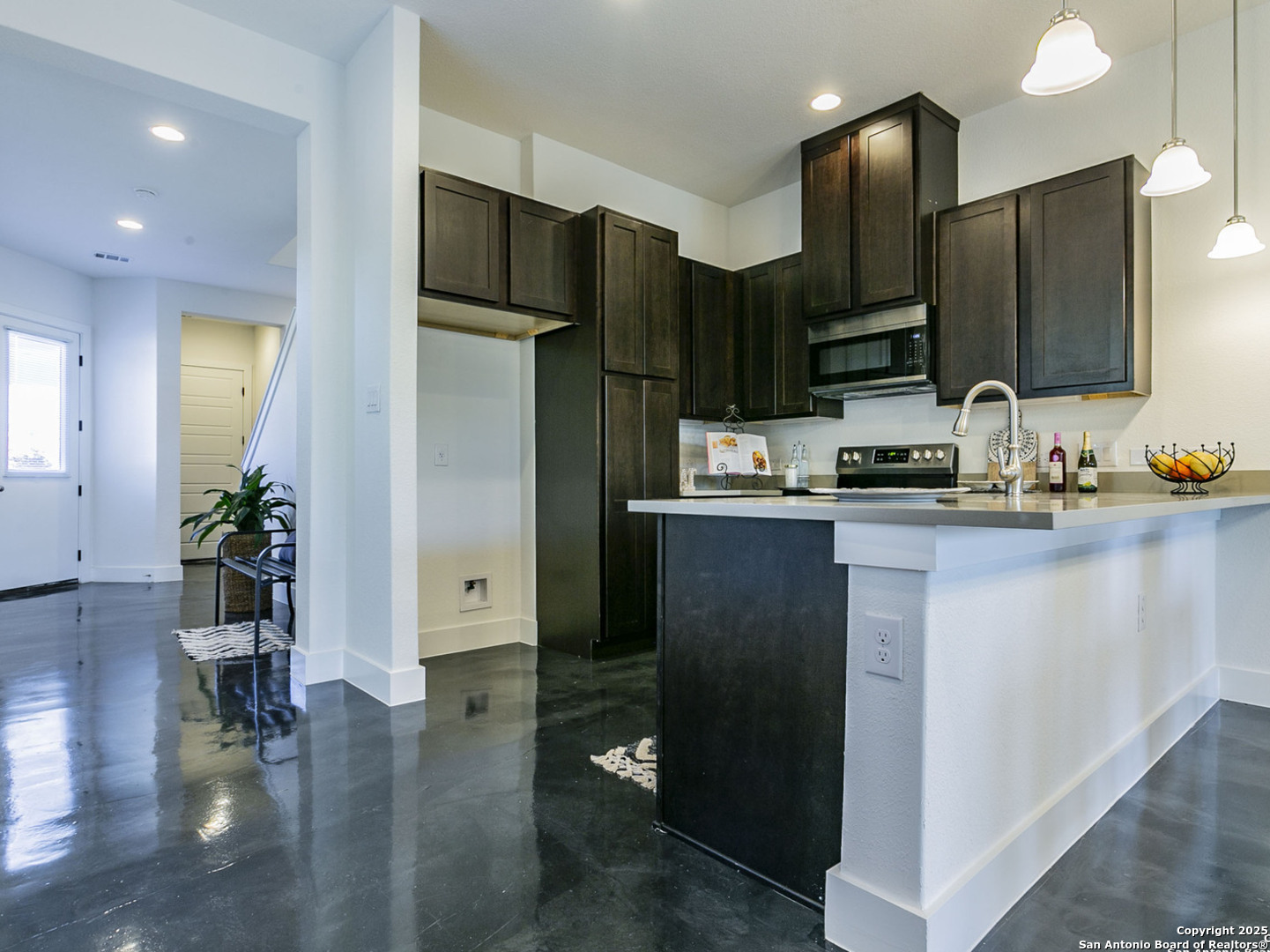 1430 Hays Street, Unit 101 San Antonio, TX 78202 - Photo 16 of 25 a kitchen with stainless steel appliances a refrigerator and a sink