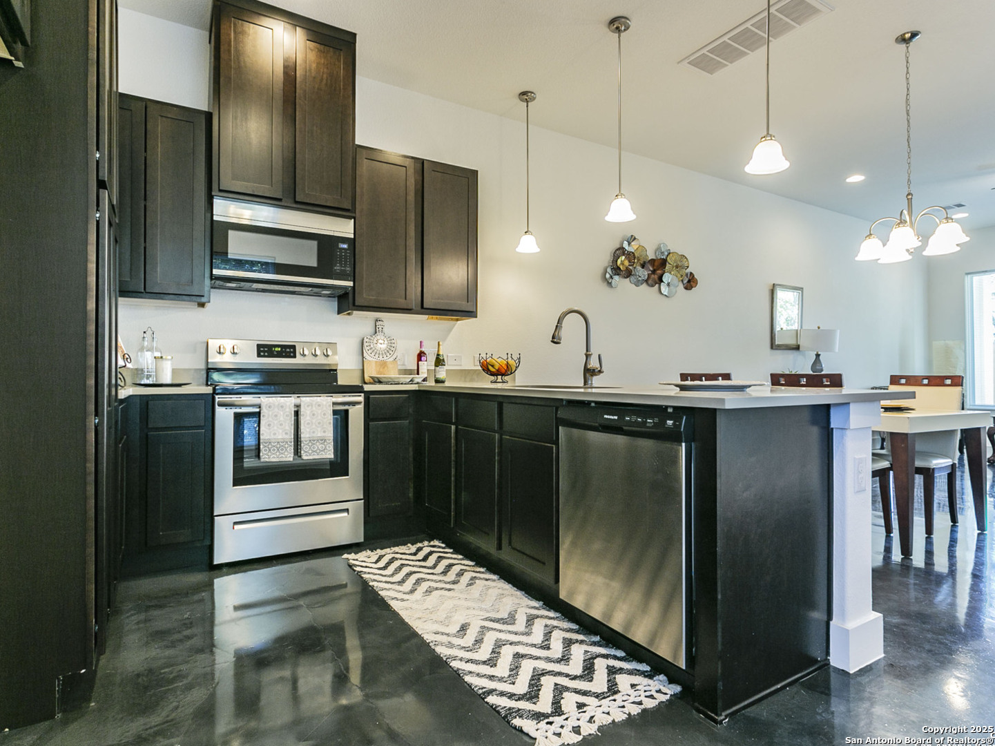 1430 Hays Street, Unit 101 San Antonio, TX 78202 - Photo 2 of 25 a kitchen with stainless steel appliances granite countertop a sink a stove and a refrigerator