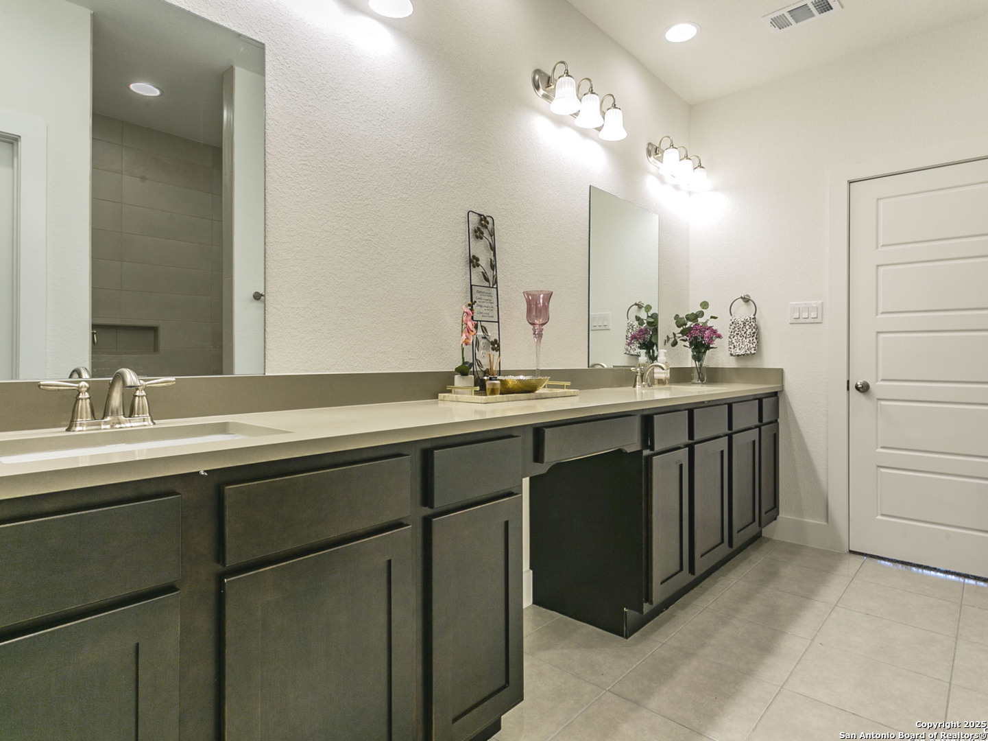 1430 Hays Street, Unit 101 San Antonio, TX 78202 - Photo 4 of 25 a bathroom with a sink double vanity and a mirror