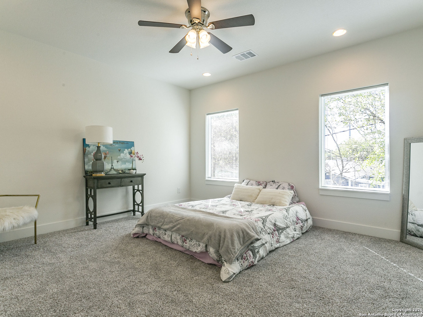 1430 Hays Street, Unit 101 San Antonio, TX 78202 - Photo 6 of 25 a bedroom with a bed table and window