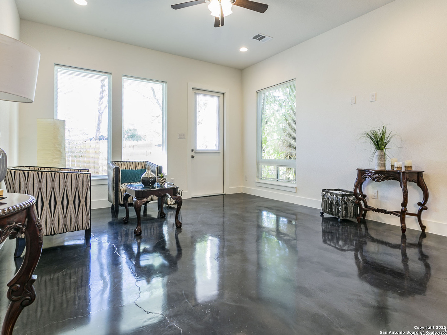 1430 Hays Street, Unit 101 San Antonio, TX 78202 - Photo 10 of 25 a living room with furniture and a large window