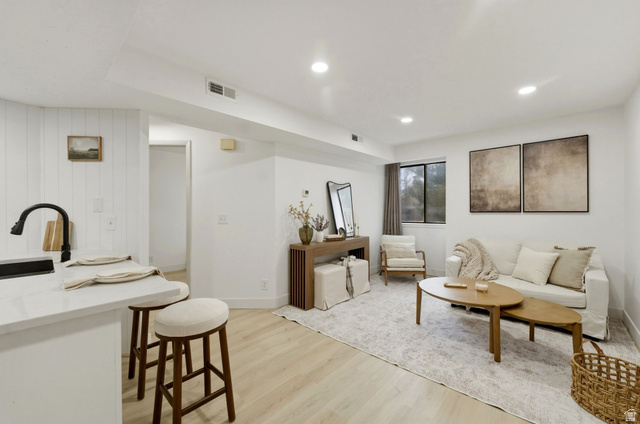 1175 Canyon Road, Unit 77 Ogden, UT 84404 - Photo 2 of 16 Living room with light wood-style vinyl LVP flooring and recessed lighting