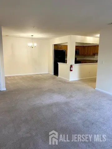 a kitchen with granite countertop a stove top oven sink and cabinets
