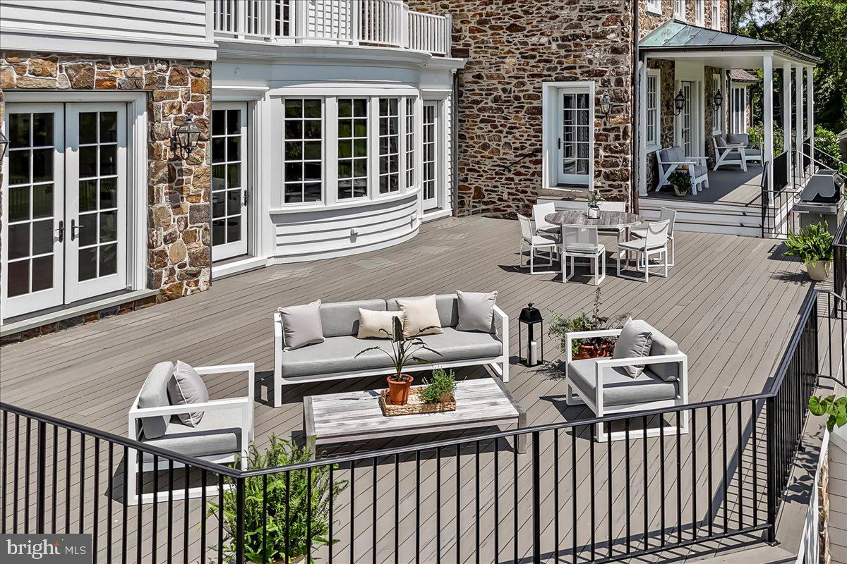 80 Heyburn Road Chadds Ford, PA 19317 - Photo 7 of 76 a view of a patio with couches table and chairs and potted plants