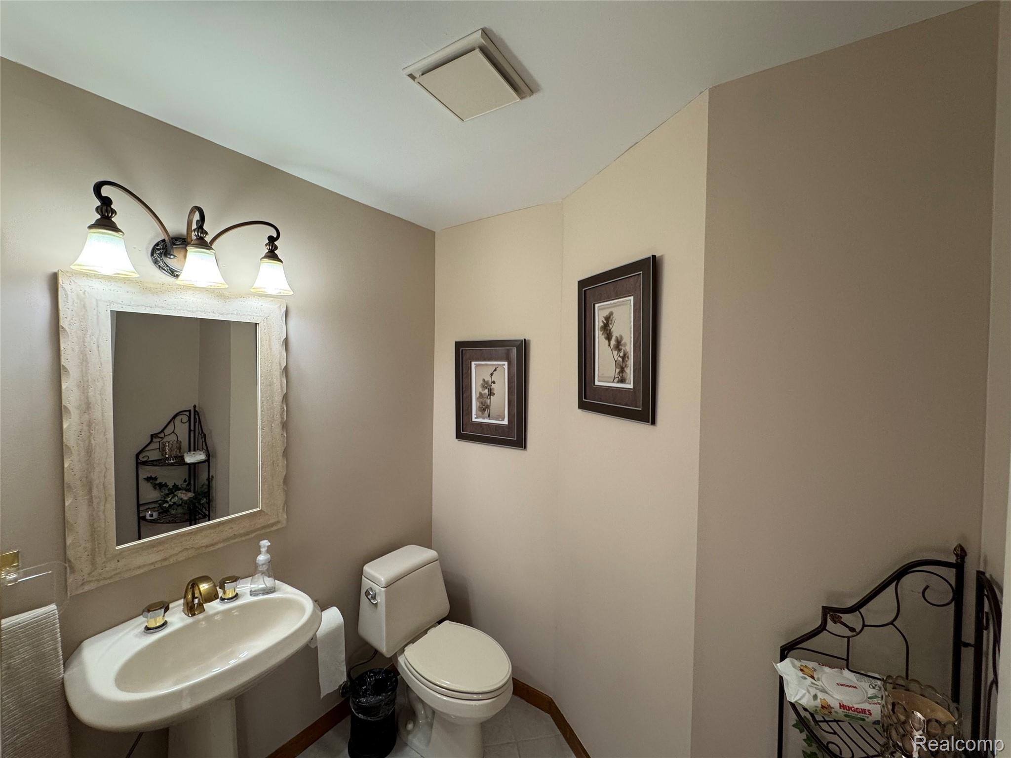 48583 Tilch Road Macomb, MI 48044 - Photo 23 of 53 Bathroom featuring toilet and tile patterned floors